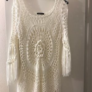 White tunic with floral pattern and fringe
